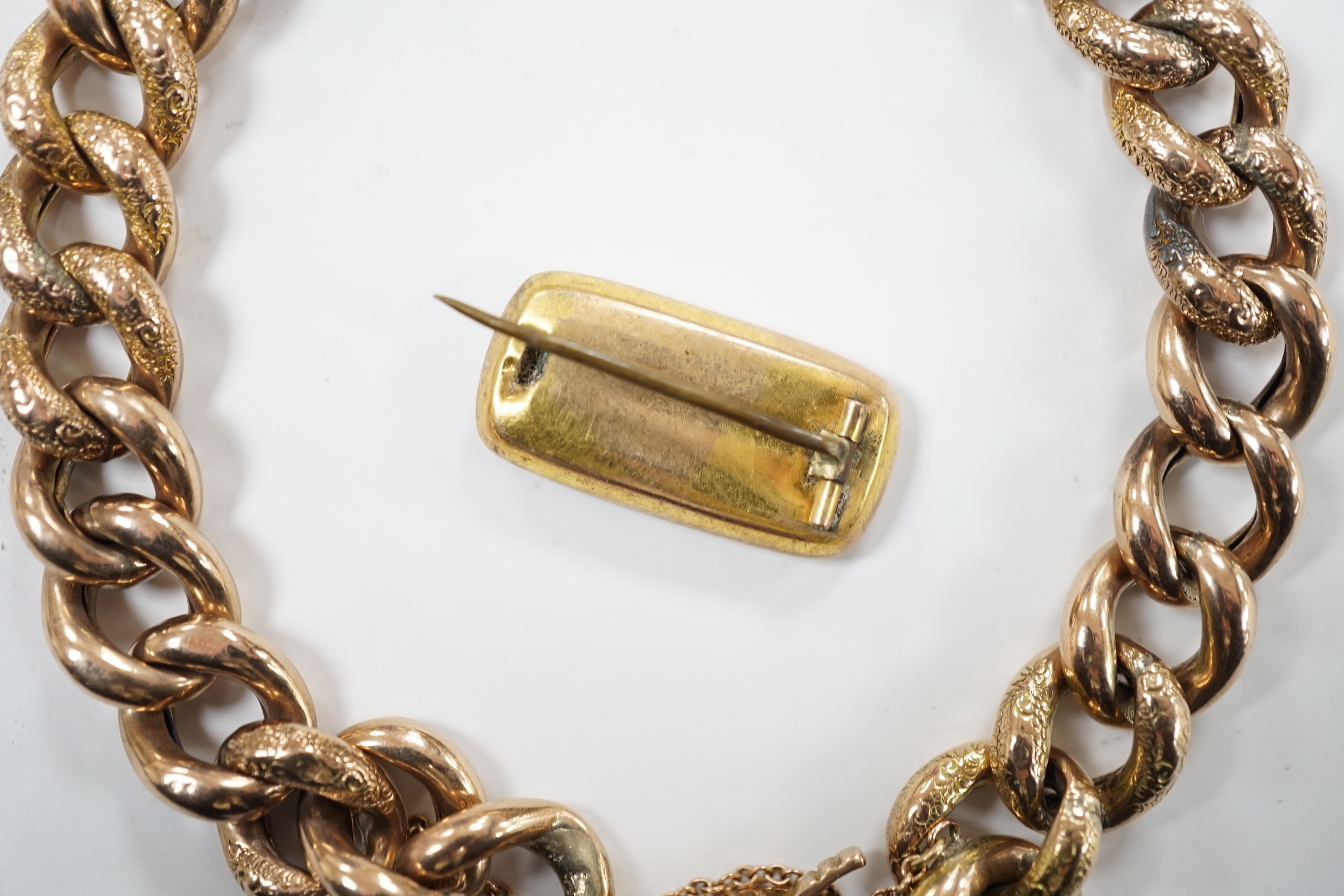 A 9ct curblink bracelet, with padlock clasp, 19cm, 22.6 grams and a 19th century brooch(a.f.)